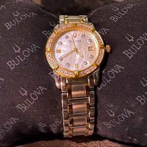 Used women’s Bulova watch silver,gold and diamonds